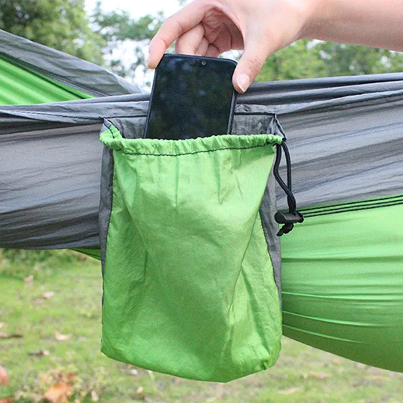 Blue parachute nylon outdoor hammock hung between trees, showing its 270cm length.