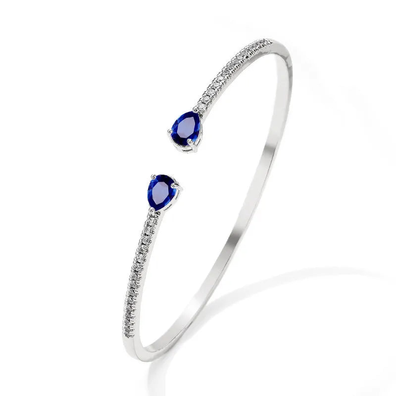 Multi-zircon fashion bracelet crafted from copper with zircon inlaid treatment in white or blue colour
