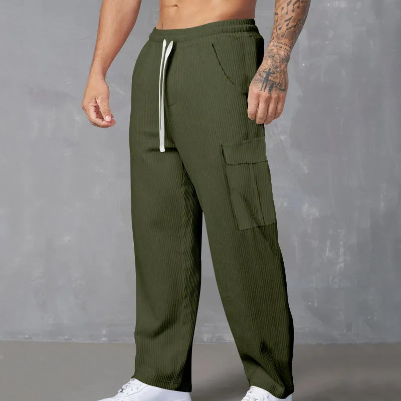 Men's loose-fitting corduroy cargo trousers in army green with a straight leg and drawstring waist.