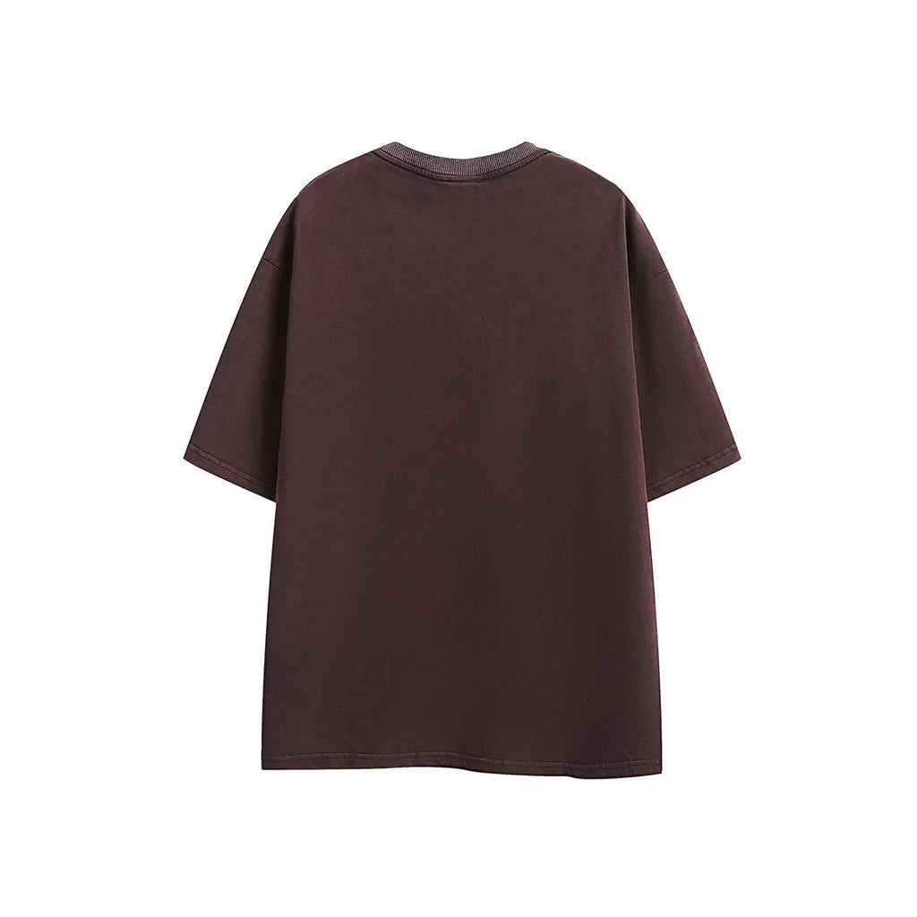 Man's loose fit black retro washed cotton short-sleeved t-shirt on a hanger.