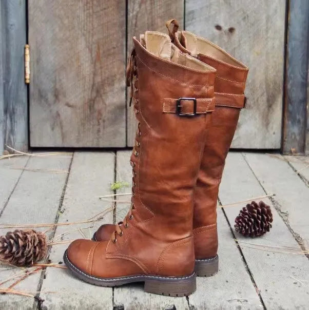Black women's chunky heel high-leg casual boots with a round toe on a plain background.