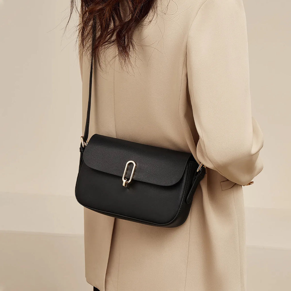 Black genuine leather square messenger bag with shoulder strap showing internal zipper pocket