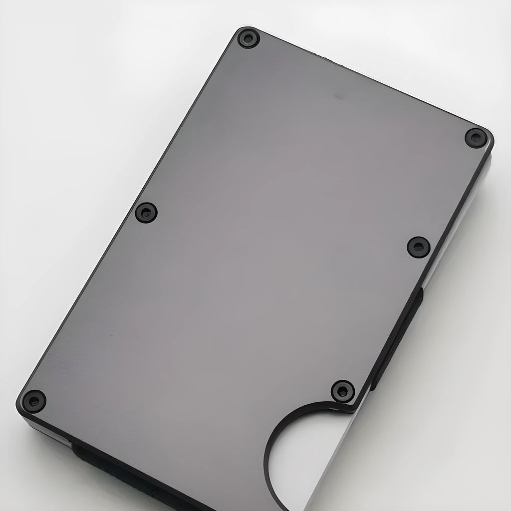 Aluminium alloy grey carbon fibre wallet with RFID blocking, showing card slots.