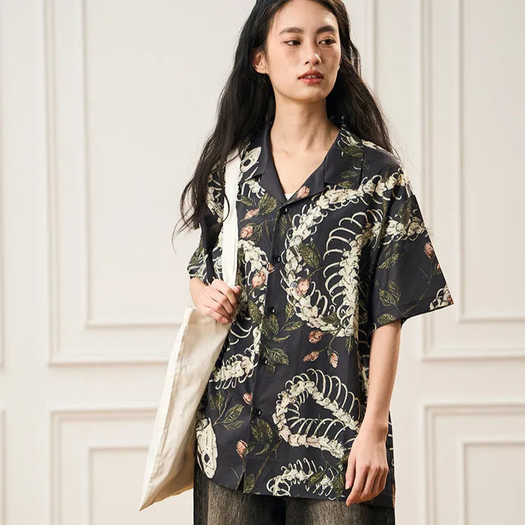 Men's loose fit short sleeve shirt with snake bone floral print and a Cuban collar.