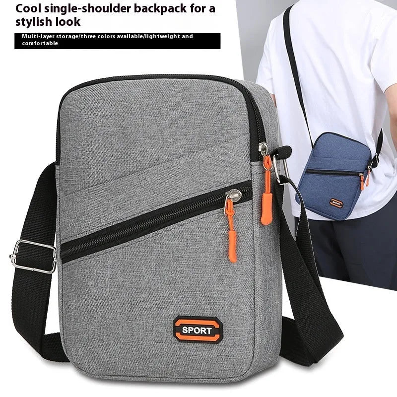 Oxford cloth commuter bag in silver grey, black, or navy blue with crossbody shoulder strap and contrast colour detailing