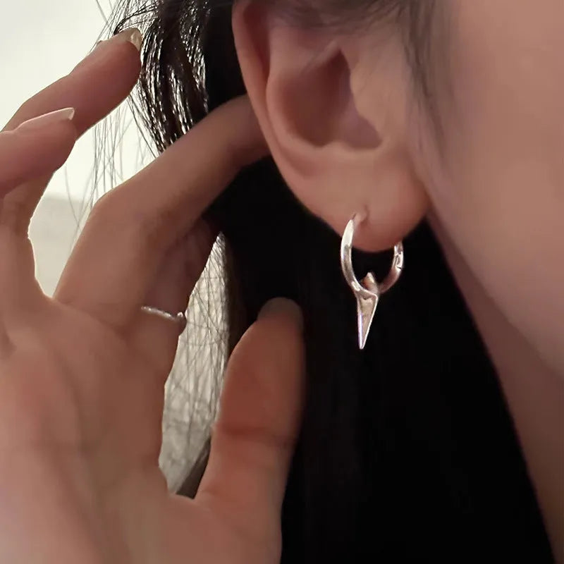 Geometric star-shaped ear clips for women with white gold plating in platinum colour