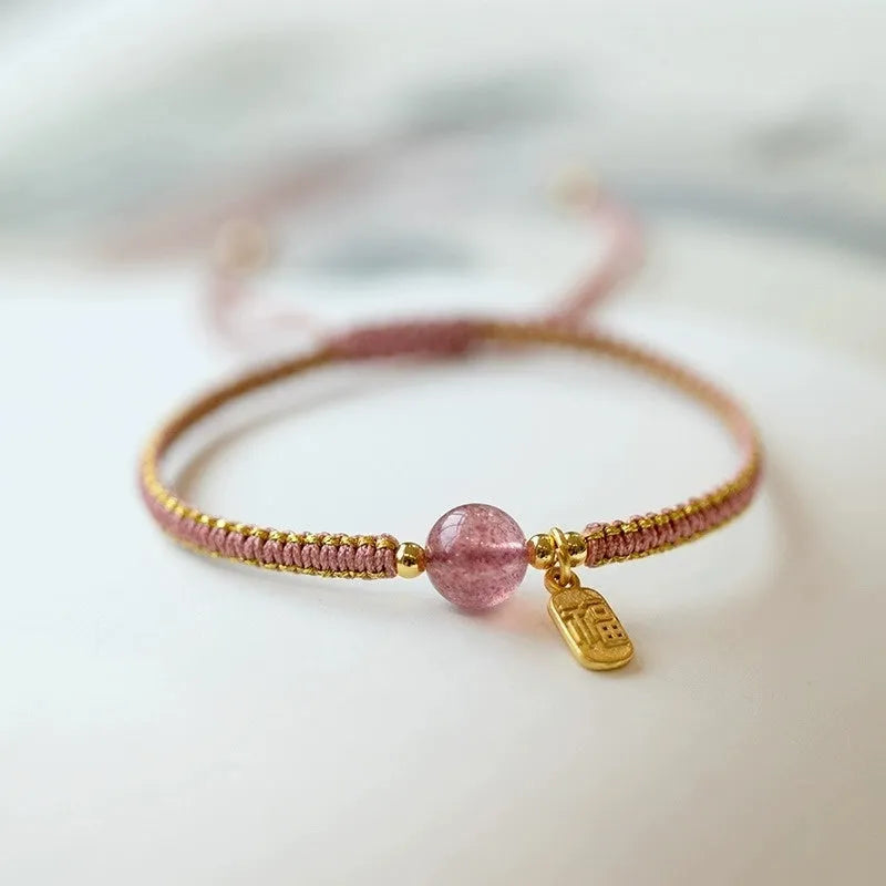 Adjustable red rope bracelet with strawberry quartz beads, showcasing national style design.