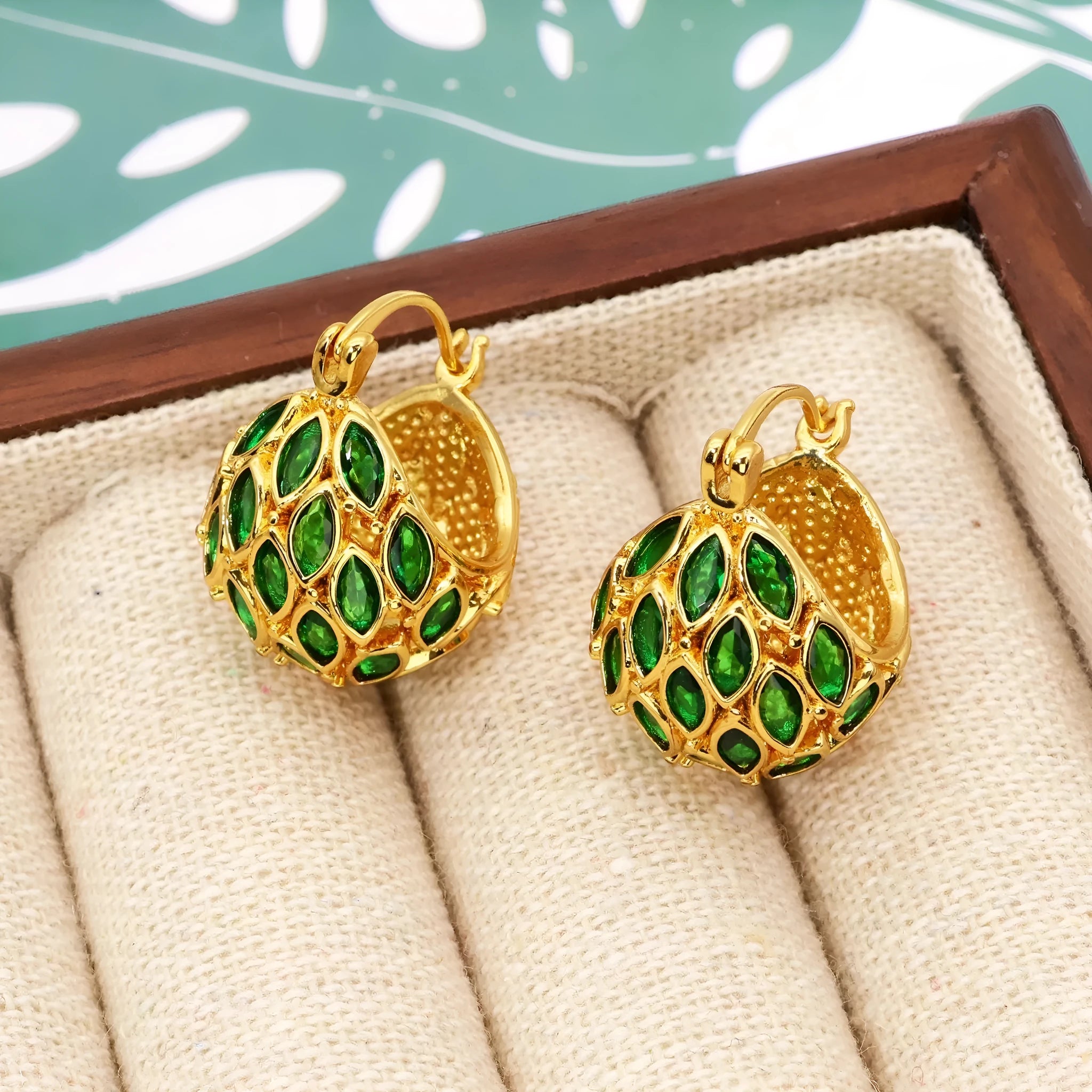 Gold copper earrings with green zircon cabochon in circular fruit shape, vintage style
