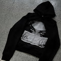 Black women's loose fit hooded sweater with dark printed cartoon pattern design