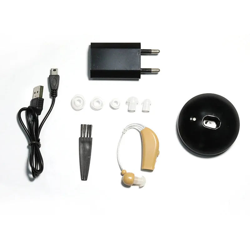 Black rechargeable hearing aid amplifier with silicone earplugs and a USB charging cable.