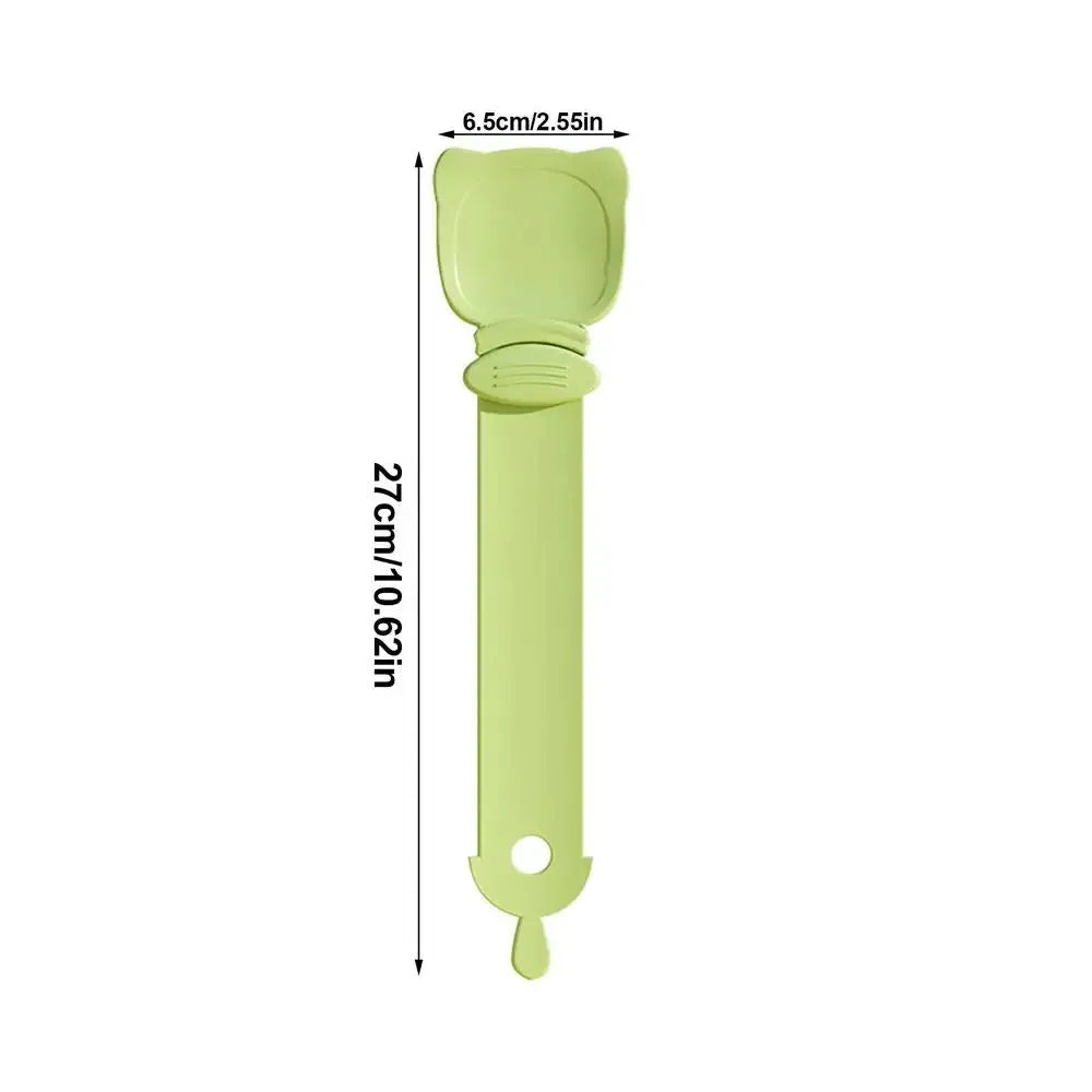 Cat Treat Spoon in green, orange, and white, measuring 27 x 6.5 cm, designed for scooping and serving cat strips