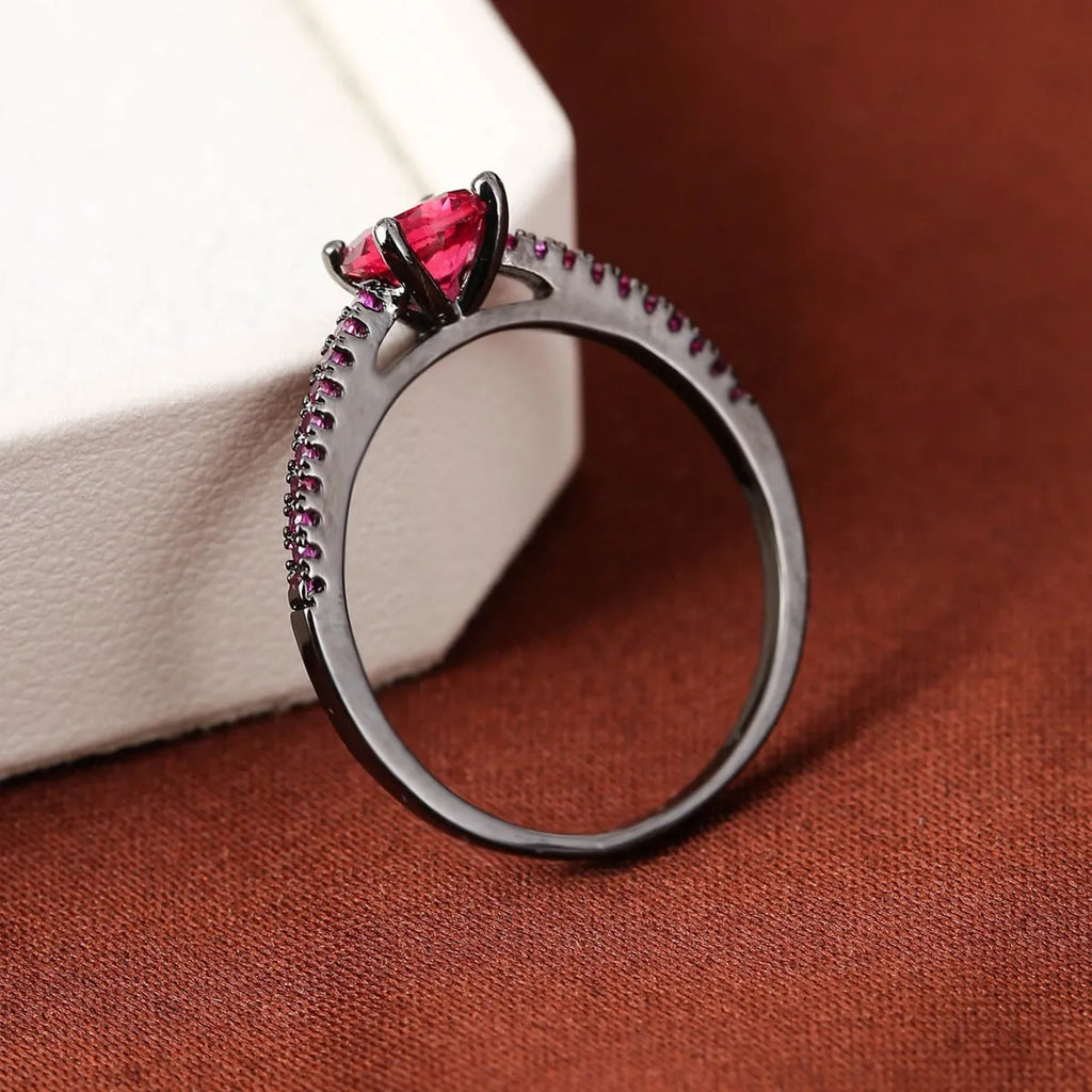 Copper zircon hexagonal geometric ring in a gold rose red electroplated finish.