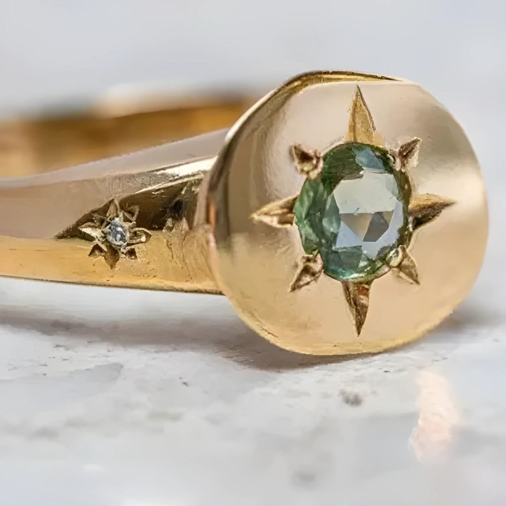 Gold coloured adjustable star ring with oval asterism zirconia stone.