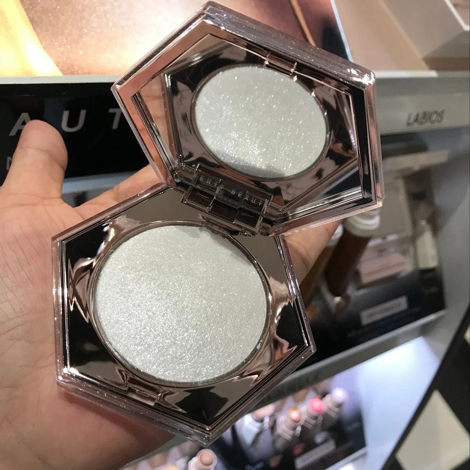 Fenty Beauty Diamond Bomb high gloss powder in compact with diamond-cut packaging