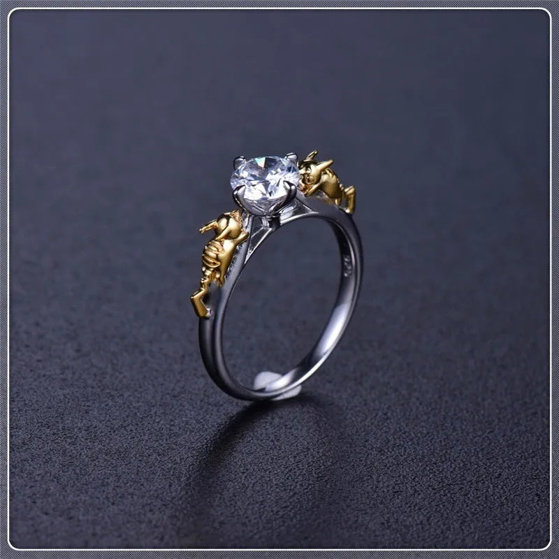 Black gold copper crown modelling ring for cosplay on a plain background.