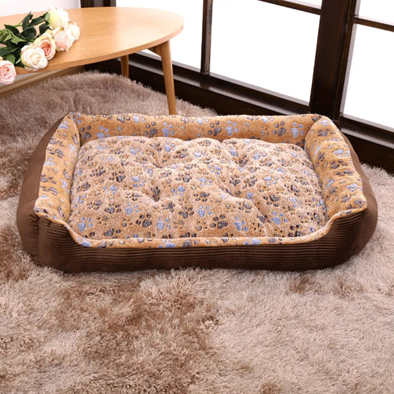 Beige plush sofa-style dog bed mat with raised sides for a small dog, shown next to size chart.
