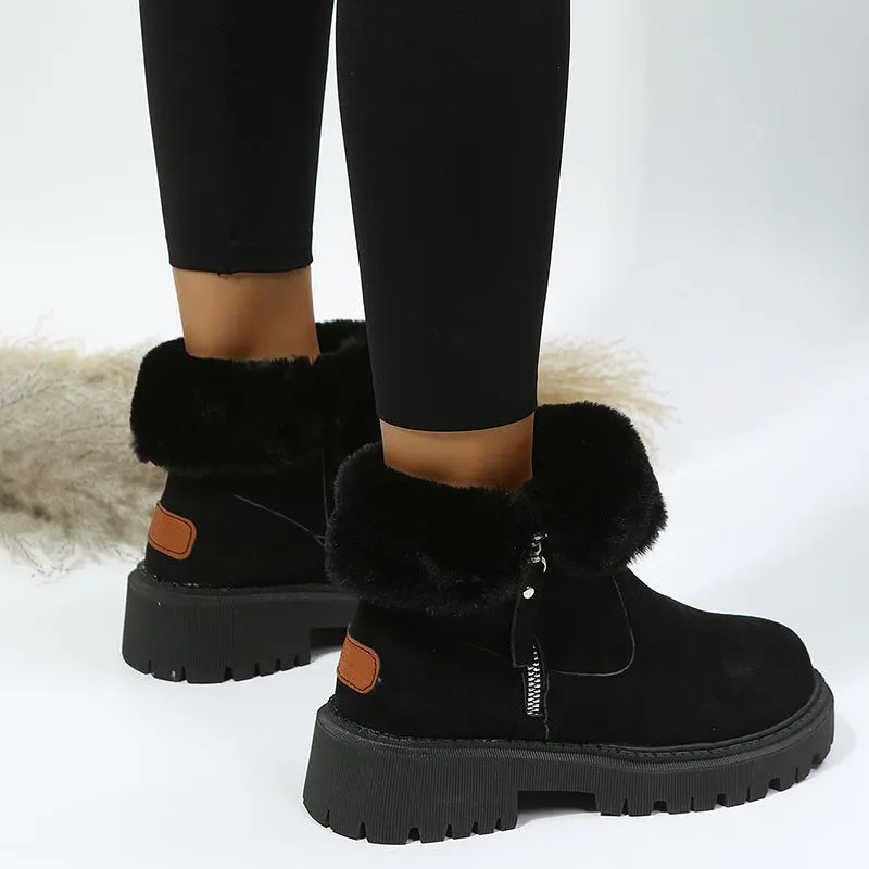 Women's black high-top faux suede snow boots with side zip and thick plush lining on a rubber sole.