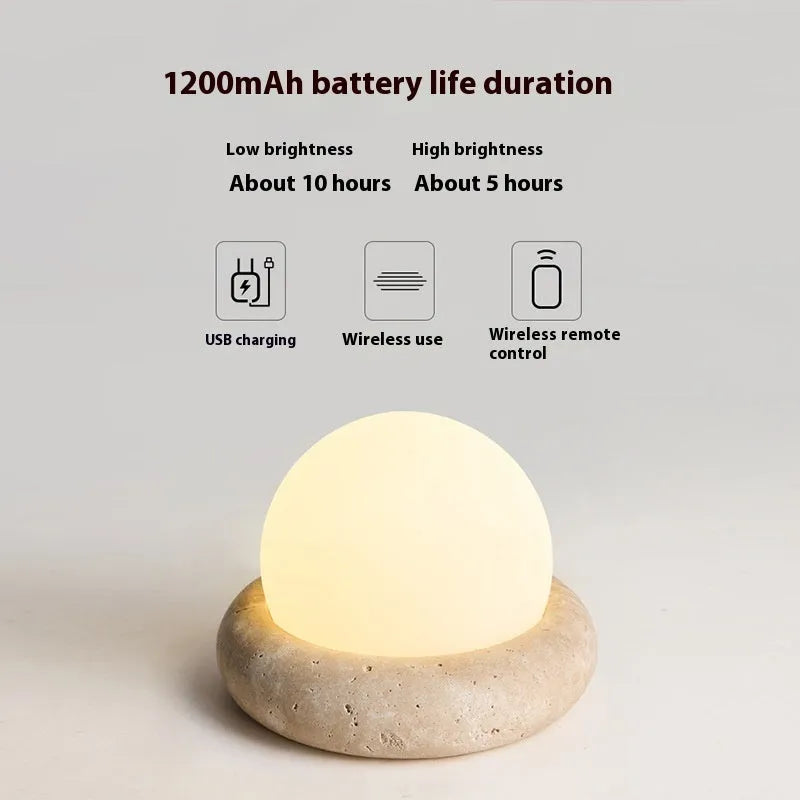 Cream coloured remote control bedside night light with circular 15.5cm diameter design