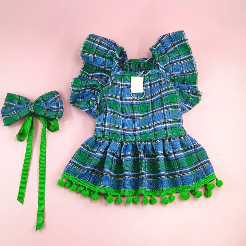 Pet wearing red Christmas tartan skirt with matching bow tie head flower