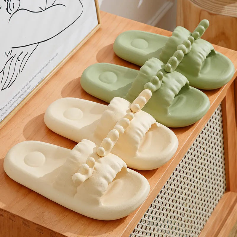 Deer horn design EVA flip flop slippers in light yellow on a white background.