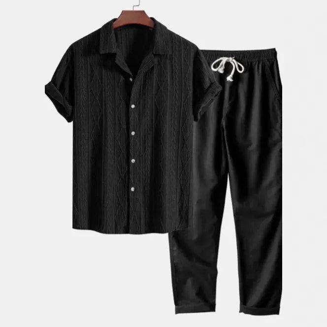 Slim-fit linen-polyester casual suit with camouflage print, showing short-sleeved cardigan shirt and matching trousers.