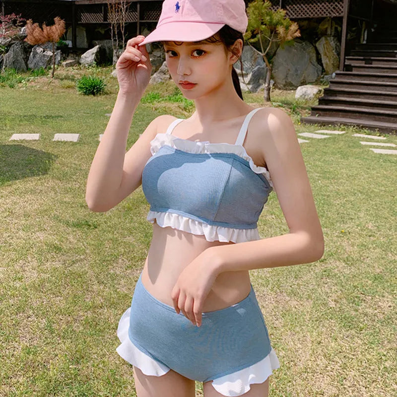 Women's conservative one-piece swimsuit with suspender straps in solid colour