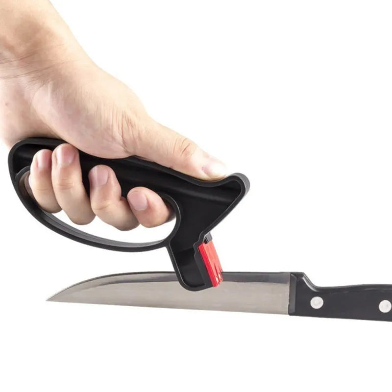 Black handheld knife and scissor sharpener with tungsten steel blade on white background