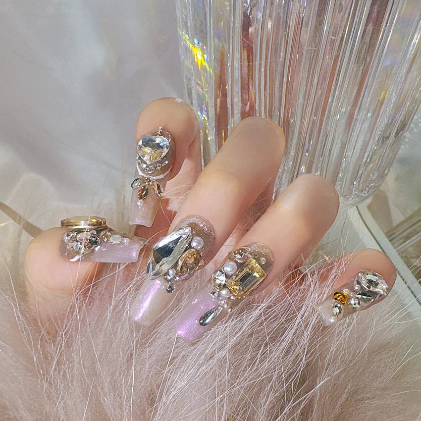 S number size luxury rhinestone false nail patches with jelly adhesive and tool options on card packaging.