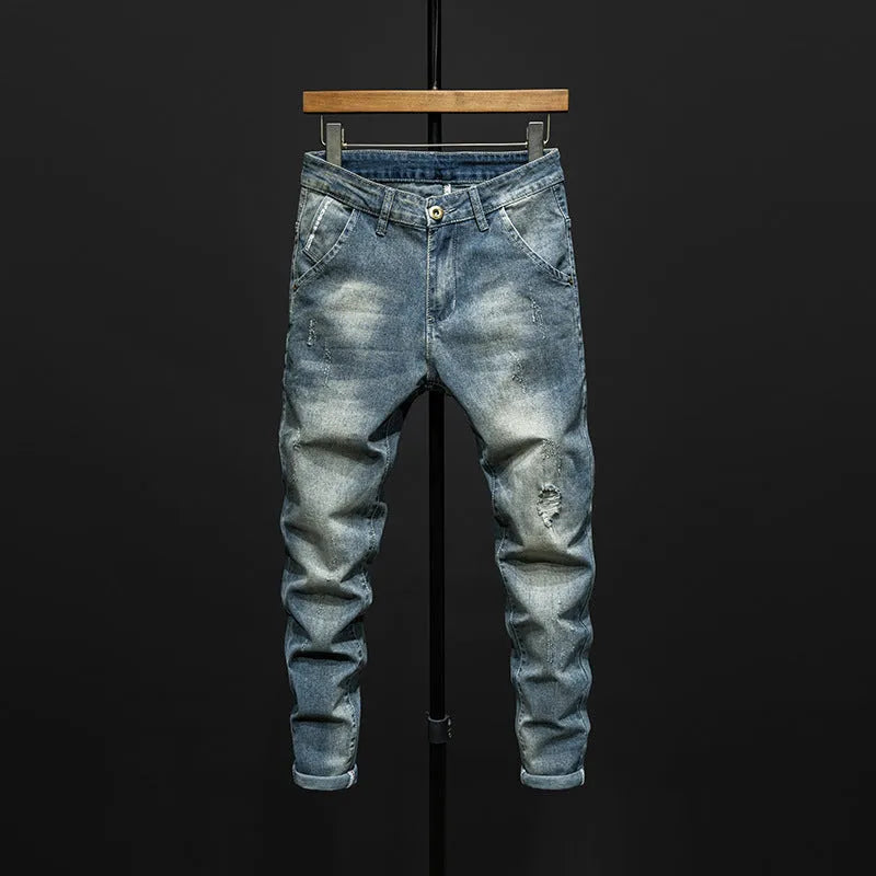 Men's slim-fitting skinny jeans in dark blue cotton denim with micro elasticity, showing mid-waist trousers design