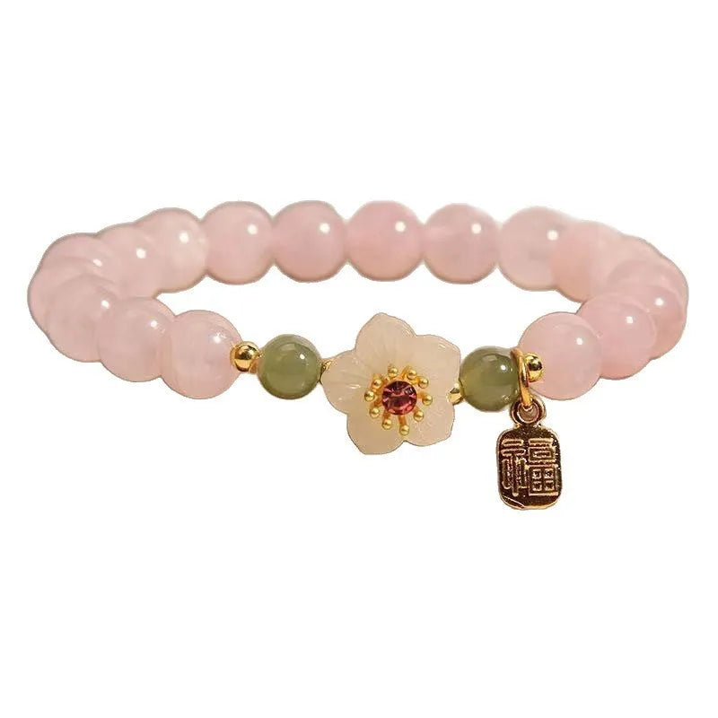 Crystal Hetian jade beaded peach blossom bracelet with camellia motifs and fruit charms in blessing card colour