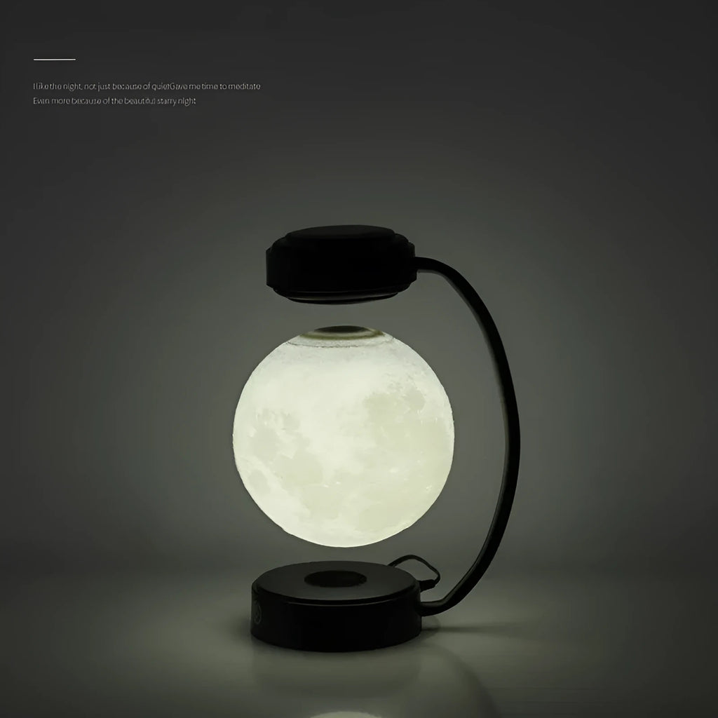 3D LED moon night light with magnetic levitation, floating ball, iron base, black finish on a desk