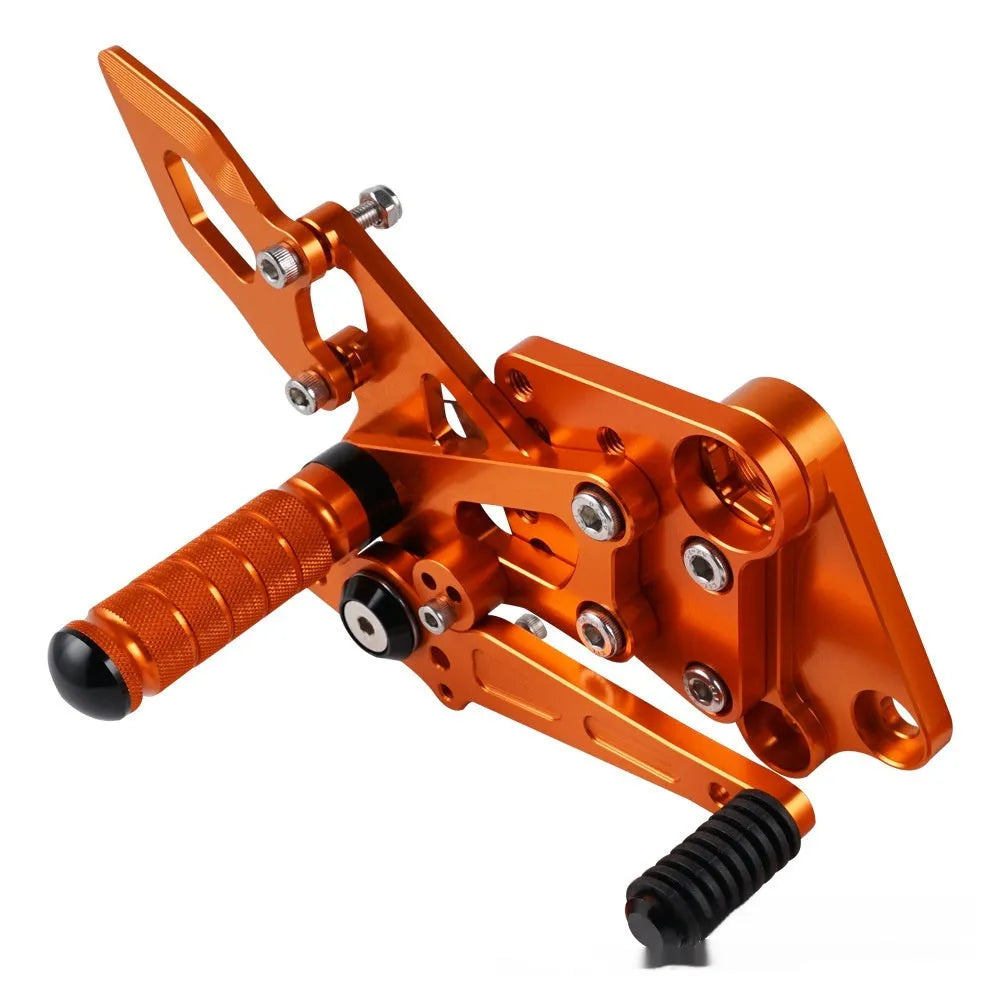 KTM Duke motorcycle raised footpeg support assembly in black and orange colours