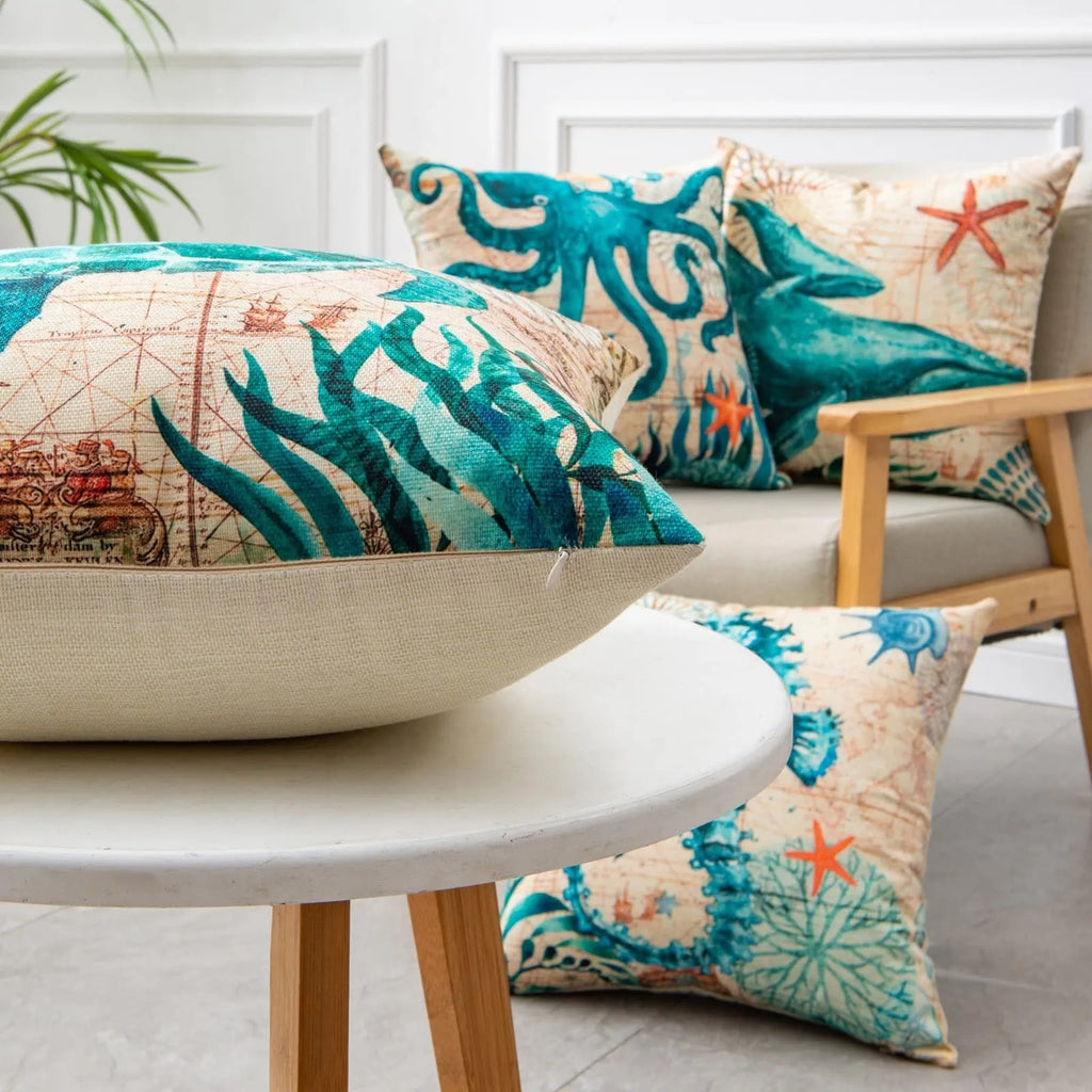 Square linen cushion cover with a detailed blue sea turtle print, showing a hidden zipper along one edge.