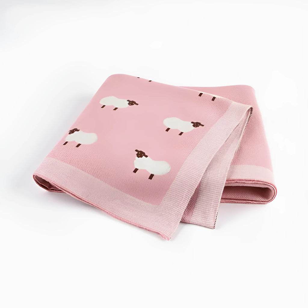 100x80cm grey and pink baby sheepskin blanket made from 100% cotton fabric laid flat.