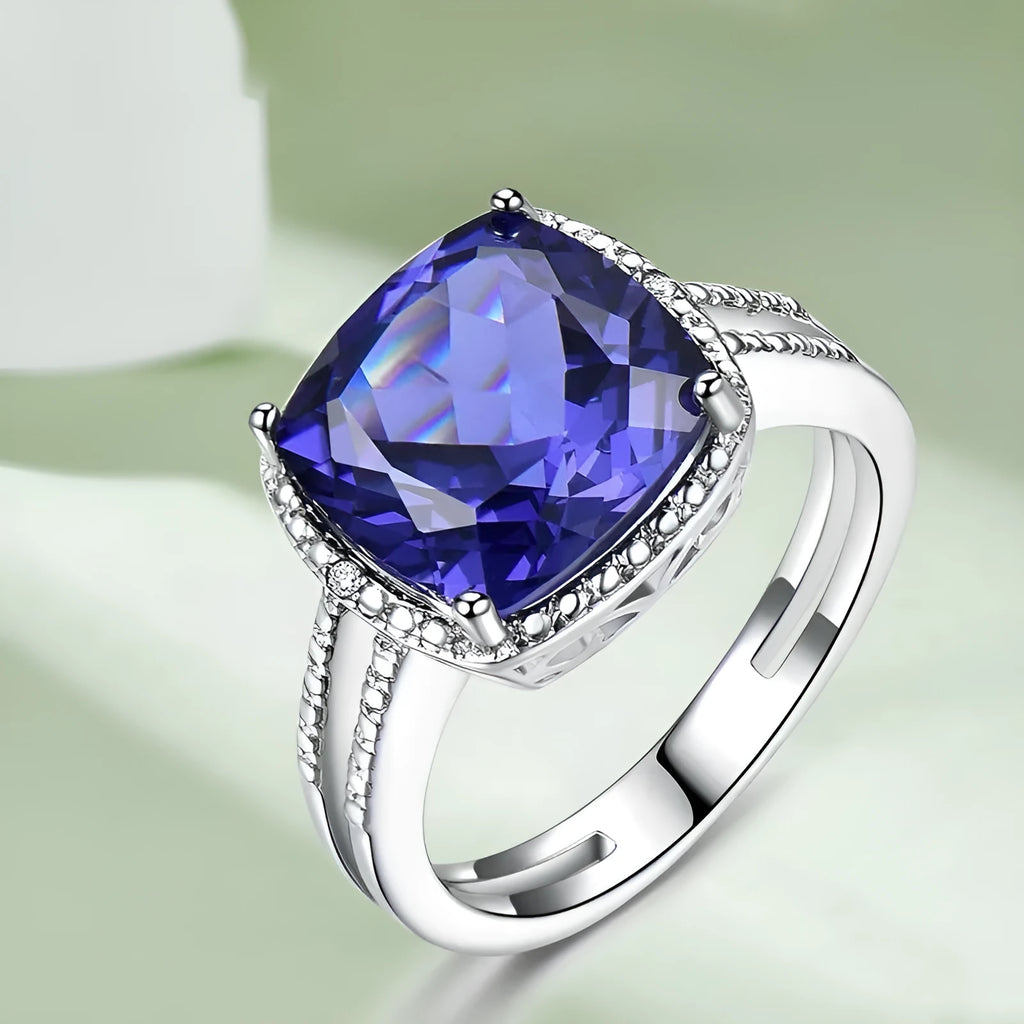 Close-up of a women's sterling silver ring with a blue tanzanite gemstone.