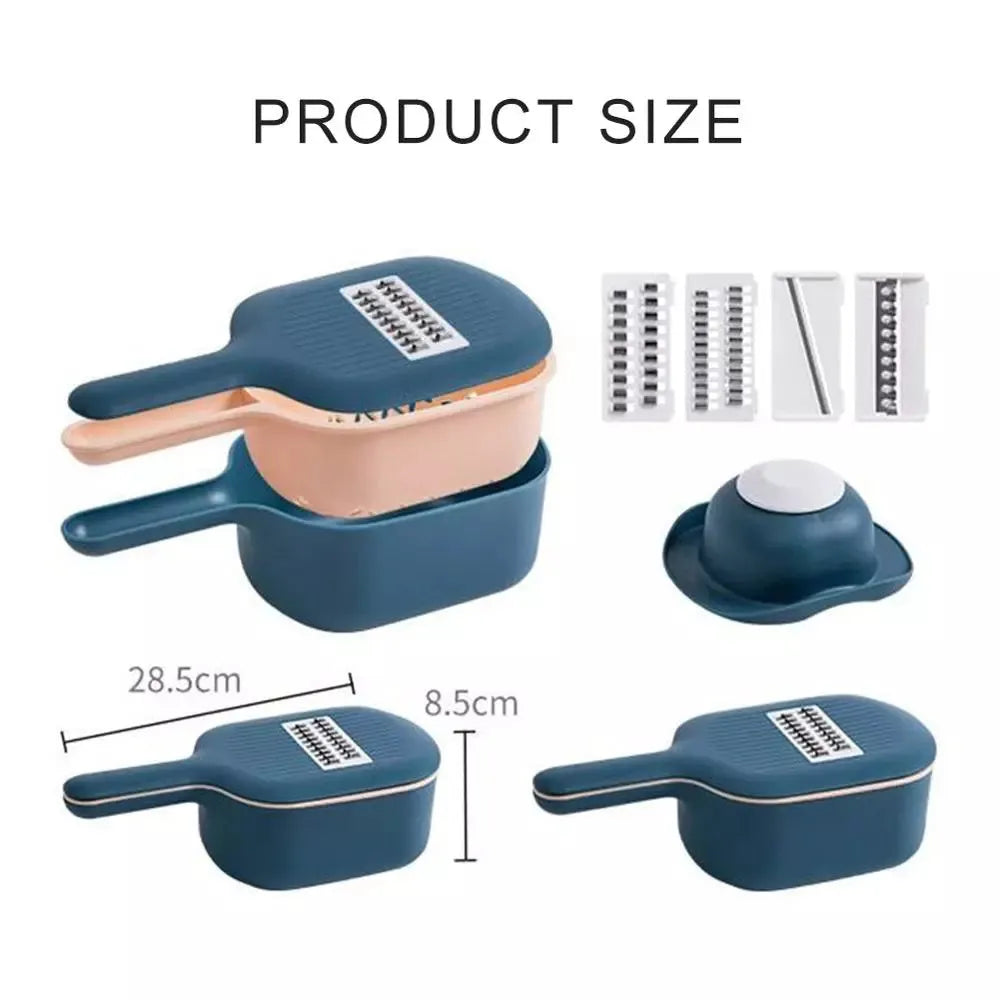 Dark blue vegetable cutter with four stainless steel blades, drain basket, and hand guard on a kitchen worktop