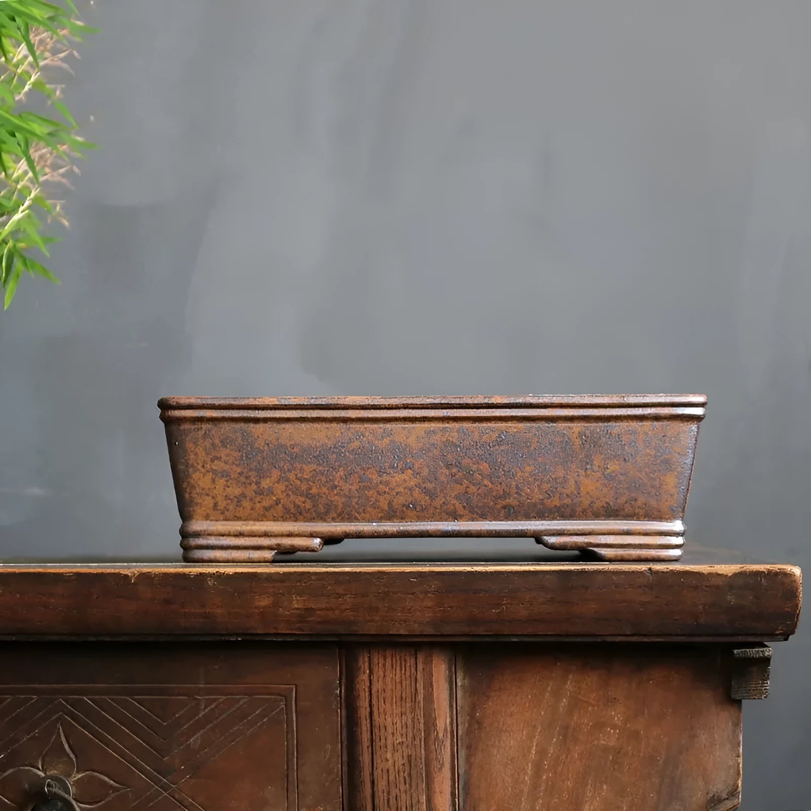 Rectangular purple sand bonsai pot with rustic firewood texture, shown empty for scale.