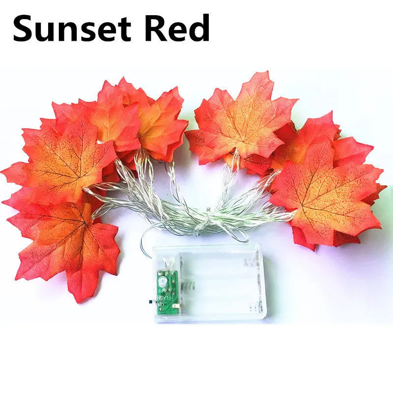 Halloween pumpkin and maple leaf LED light string on a dark background, with warm white 3000K glow
