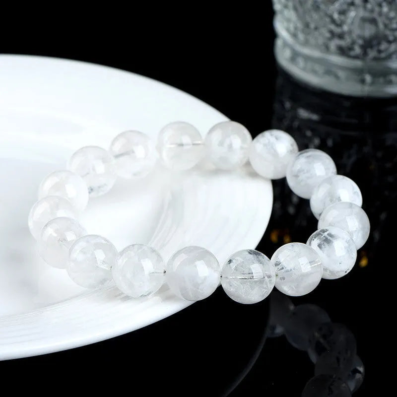Crystal women's bracelet with natural blizzard snowflake round beads in geometric shapes with traditional decorative elements