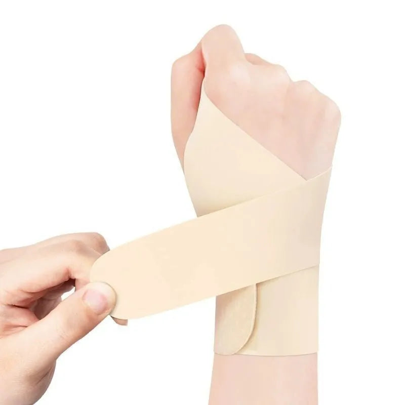 Adjustable black athletic wristguard shown on a wrist, suitable for sports like badminton and tennis.
