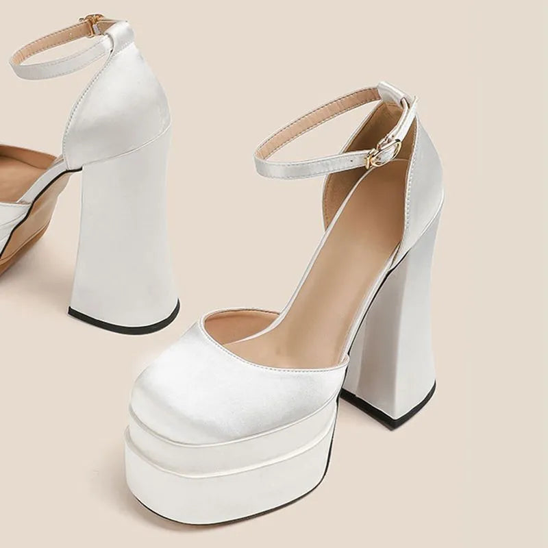 Women's white waterproof platform pumps with a chunky block heel and round toe on a neutral background.