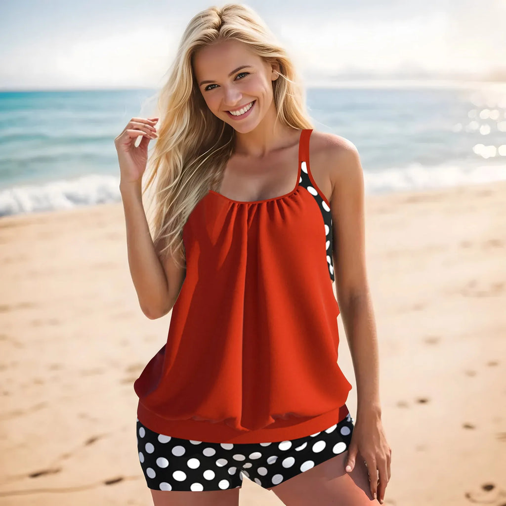 Women's black polka dot high-waisted boxer swimsuit set shown on a model.