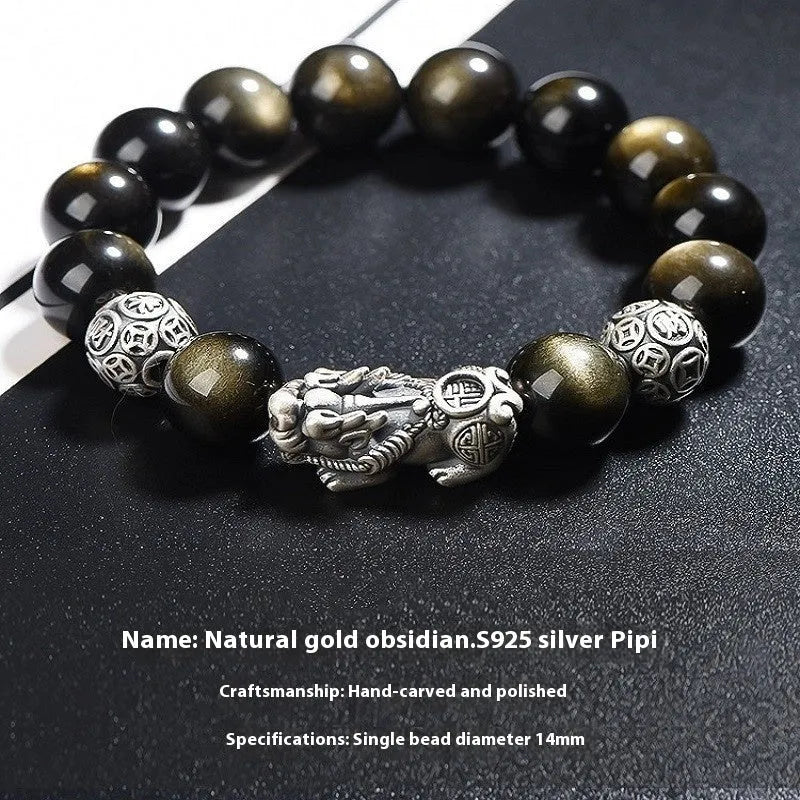 Men's geometric bracelet with obsidian stone set in 999 sterling silver on a wrist.