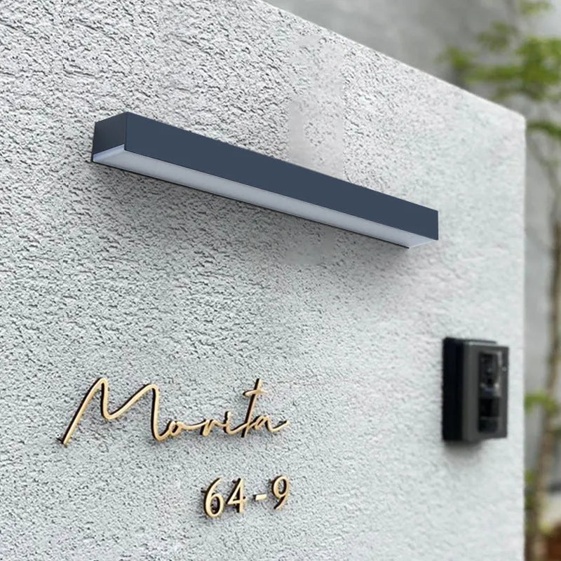 Black ABS plastic solar-powered outdoor wall strip light with IP65 rating.