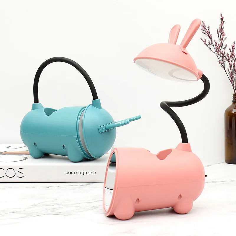 Cartoon-style USB desk lamp with integrated pen container in green colour