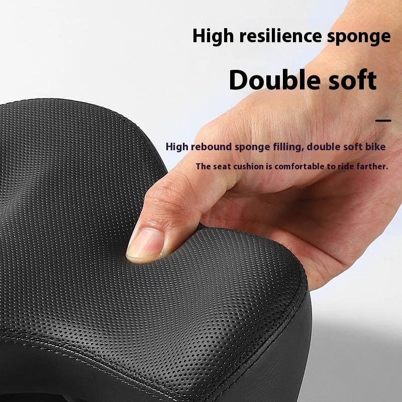 Black leather bicycle saddle cushion with thick polyurethane foam padding.