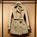 Women's khaki trench coat with double-breasted front and flight sleeves in British style