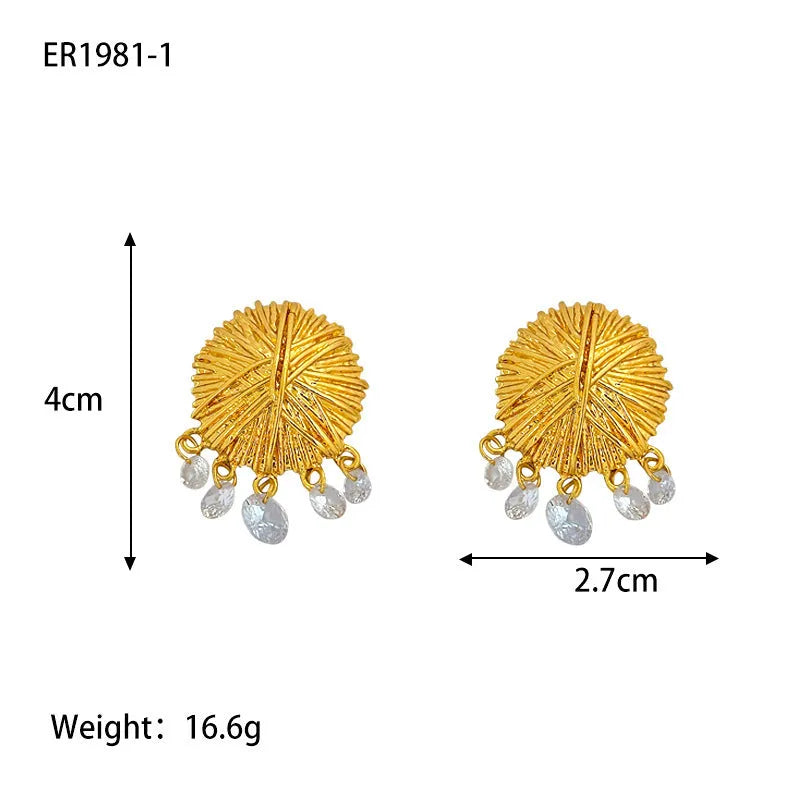 A pair of gold geometric metal earrings with round elements and an electroplated finish.