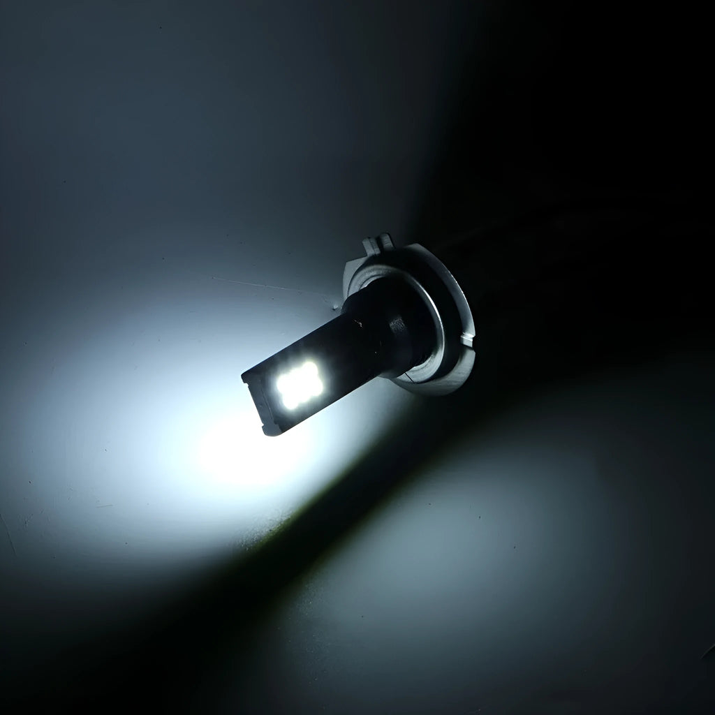 Single H7 110W LED fog light bulb with 12 SMD LEDs and aluminium housing on a white background.