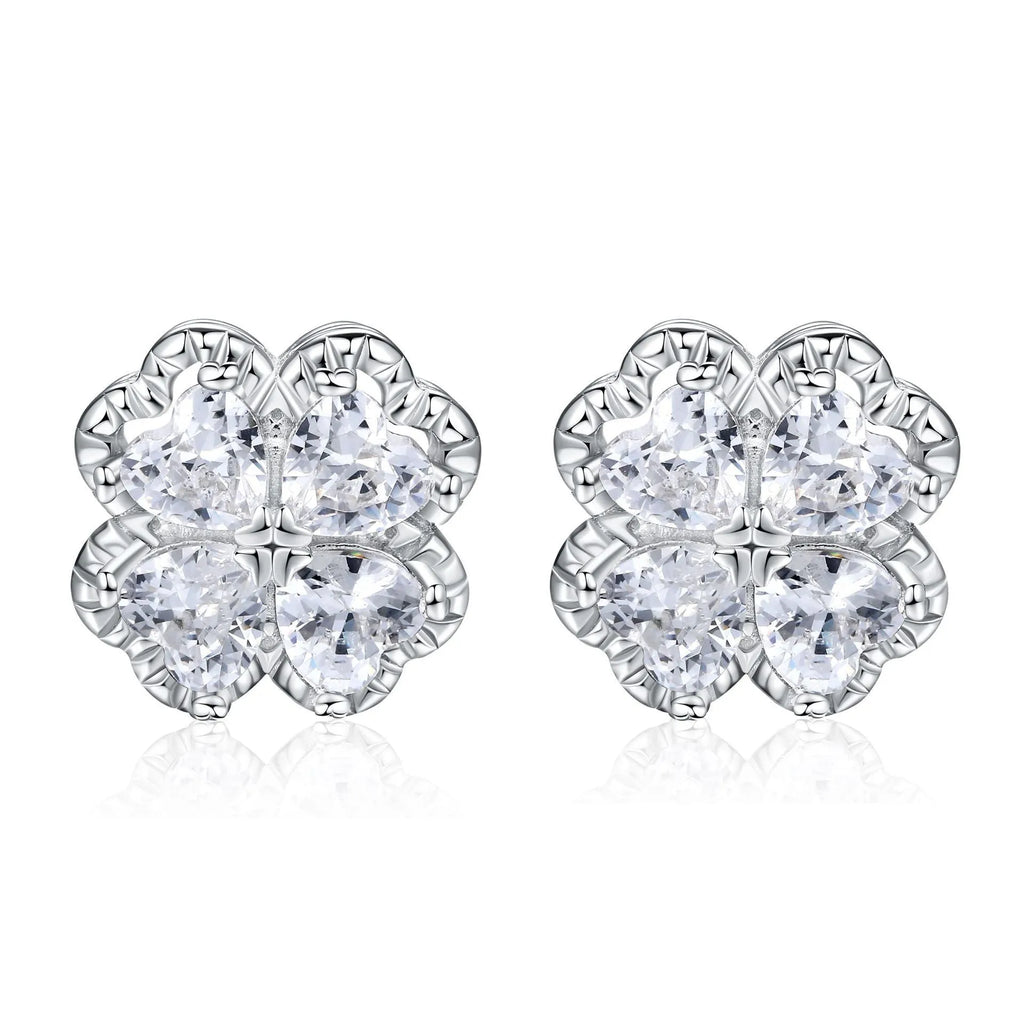 Pair of silver heart-shaped earrings with a four-leaf clover design and zircon stones in white gold colour.